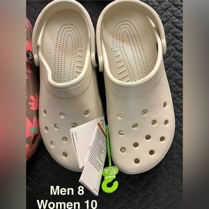 Brand new Crocs.    Women size 10 Men size 8
